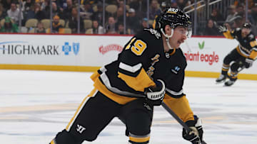 Mar 11, 2025; Pittsburgh, Pennsylvania, USA;  Pittsburgh Penguins center Connor Dewar (19) shoots the puck against the Vegas Golden Knights during the third period at PPG Paints Arena. Mandatory Credit: Charles LeClaire-Imagn Images
