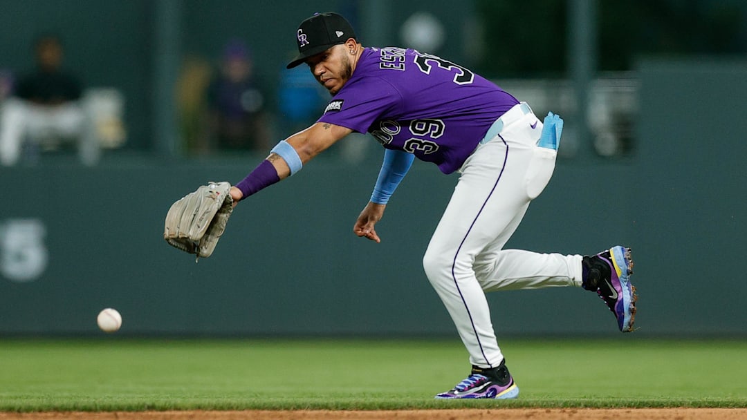 Aug 4, 2025; Denver, Colorado, USA; Colorado Rockies second baseman Thairo Estrada (39) is unable to field the ball in the ninth inning against the Toronto Blue Jays at Coors Field. Mandatory Credit: Isaiah J. Downing-Imagn Images