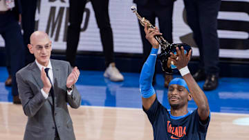 NBA commissioner Adam Silver presents Oklahoma City Thunder guard Gilgeous-Alexander (2) with the Michael Jordan Trophy for winning the most valuable player award for the 2024-25 season.