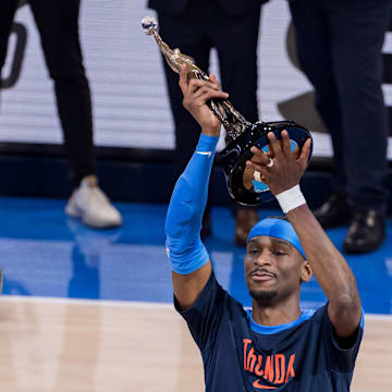 NBA commissioner Adam Silver presents Oklahoma City Thunder guard Gilgeous-Alexander (2) with the Michael Jordan Trophy for winning the most valuable player award for the 2024-25 season.