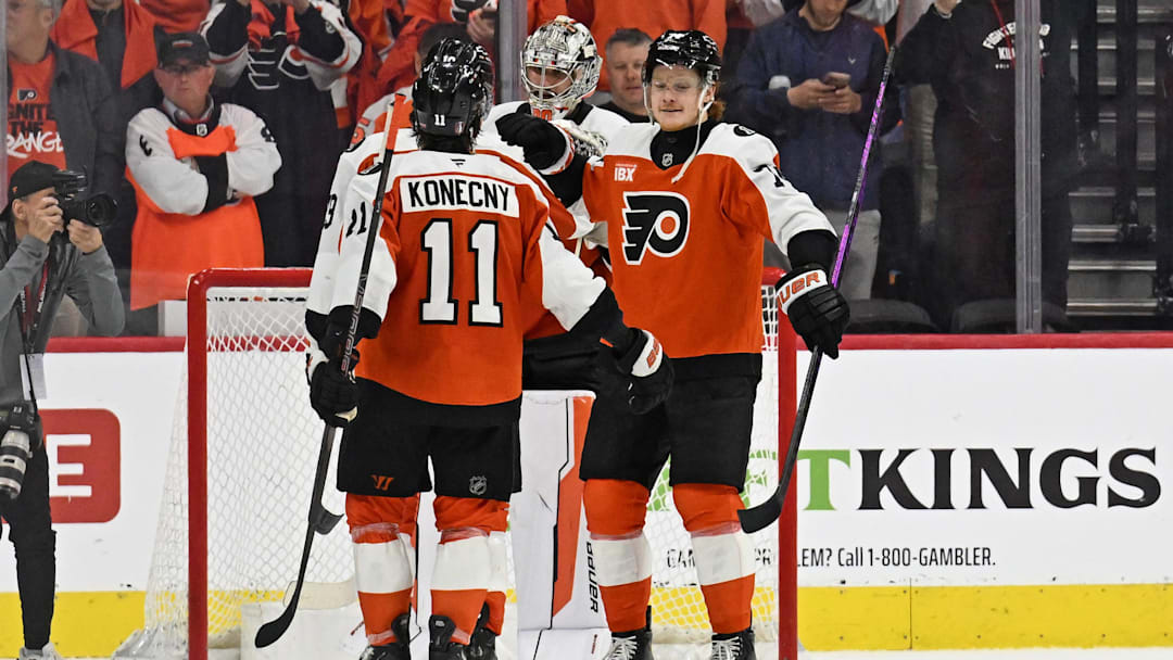 Apr 22, 2026; Philadelphia, Pennsylvania, USA; Philadelphia Flyers right wing Owen Tippett (74) celebrates win with right wing Travis Konecny (11) against the Pittsburgh Penguins in game three of the first round of the 2026 Stanley Cup Playoffs at Xfinity Mobile Arena.