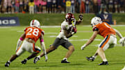 Oct 18, 2025; Charlottesville, Virginia, USA; Washington State Cougars running back Leo Pulalasi (20) runs with the ball as Virginia Cavaliers defensive back Donavon Platt (28) and Cavaliers linebacker James Jackson (1) chase in the third quarter at Scott Stadium. Mandatory Credit: Geoff Burke-Imagn Images
