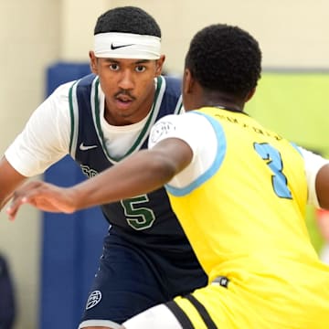 July 15, 2025; North Augusta, South Carolina, USA; Oakland Soldiers Jason Crowe Jr. (5) dribbles as Team Final RJ Smith (3) defends during the Oakland Soldiers and Team Final game at Nike EYBL Peach Jam at Riverview Park Activities Center. Crowe Jr., a top-five commit in the 2027 class, announced his commitment to the Missouri Tigers on Friday. 