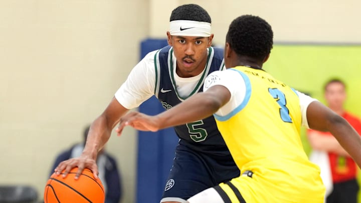 July 15, 2025; North Augusta, South Carolina, USA; Oakland Soldiers Jason Crowe Jr. (5) dribbles as Team Final RJ Smith (3) defends during the Oakland Soldiers and Team Final game at Nike EYBL Peach Jam at Riverview Park Activities Center. Crowe Jr., a top-five commit in the 2027 class, announced his commitment to the Missouri Tigers on Friday. 
