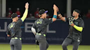 Tampa Bay Rays outfielder Christopher Morel (right) is congratulated by Taylor Walls (center) and Brandon Lowe after a win.