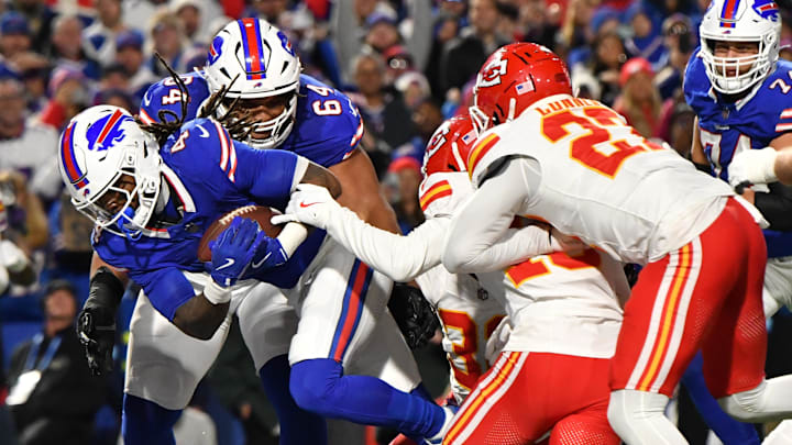  Buffalo Bills running back James Cook (4) scores a touchdown against the Kansas City Chiefs in the second quarter at Highmark Stadium.