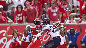 Sep 8, 2018; Houston, TX, USA; Arizona Wildcats cornerback Azizi Hearn (20) defends against a pass intended for Houston Cougars quarterback Bryson Smith (1) during the third quarter at TDECU Stadium. Mandatory Credit: Troy Taormina-Imagn Images