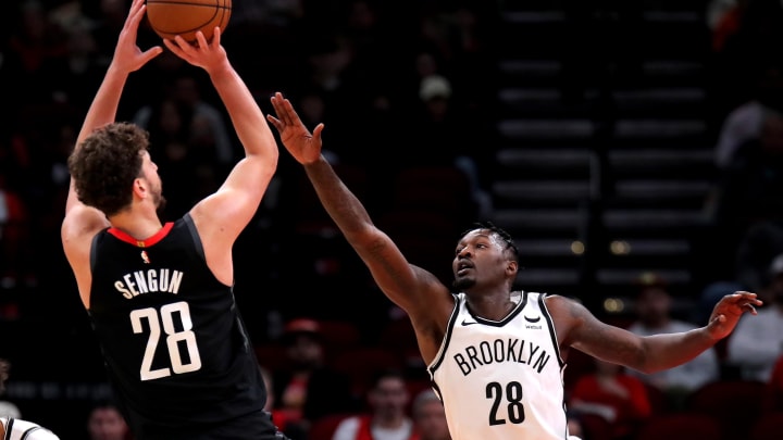 Jan 3, 2024; Houston, Texas, USA; Houston Rockets center Alperen Sengun (28) shoots against Brooklyn Nets forward Dorian Finney-Smith (28) during the first quarter at Toyota Center. Mandatory Credit: Erik Williams-USA TODAY Sports