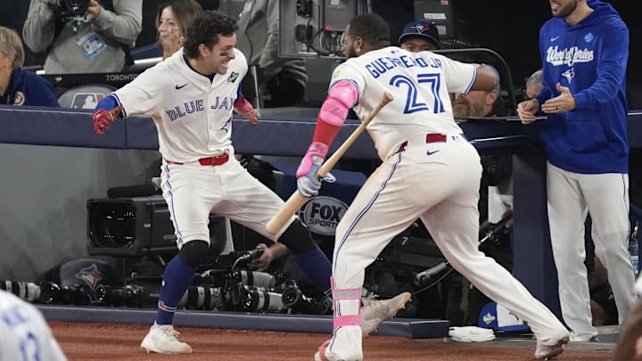 Nov 1, 2025; Toronto, Ontario, CAN; Toronto Blue Jays third baseman Ernie Clement (22) celebrates with first baseman Vladimir Guerrero Jr. (27) after scoring against the Los Angeles Dodgers in the sixth inning during game seven of the 2025 MLB World Series at Rogers Centre. Nov 1, 2025; Toronto, Ontario, CAN; Toronto Blue Jays third baseman Ernie Clement (22) celebrates with first baseman Vladimir Guerrero Jr. (27) after scoring against the Los Angeles Dodgers in the sixth inning during game seven of the 2025 MLB World Series at Rogers Centre.