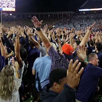 Sep 26, 2025; Charlottesville, Virginia, USA; Virginia Cavaliers fans and players celebrate on the field after their game against the Florida State Seminoles at Scott Stadium. Mandatory Credit: Geoff Burke-Imagn Images