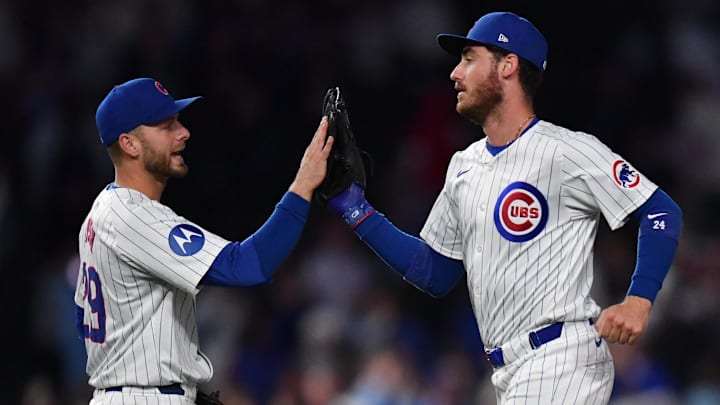 Aug 20, 2024; Chicago, Illinois, USA; Chicago Cubs first base Michael Busch (29) and right fielder Cody Bellinger (24) celebrate after defeating the Detroit Tigers at Wrigley Field