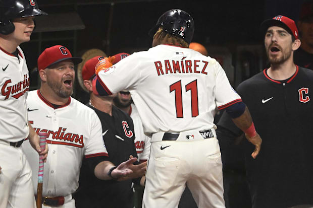 Jose Ramirez (11) is greeted at the dugout after hitting his second home run of the game