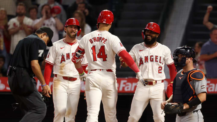 Jun 28, 2024; Anaheim, California, USA;  Los Angeles Angels catcher Logan O'Hoppe (14) is greeted by designated hitter Taylor Ward (3) and third baseman Luis Rengifo (2) after hitting a three-run home run during the eighth inning against the Detroit Tigers at Angel Stadium. Mandatory Credit: Kiyoshi Mio-USA TODAY Sports