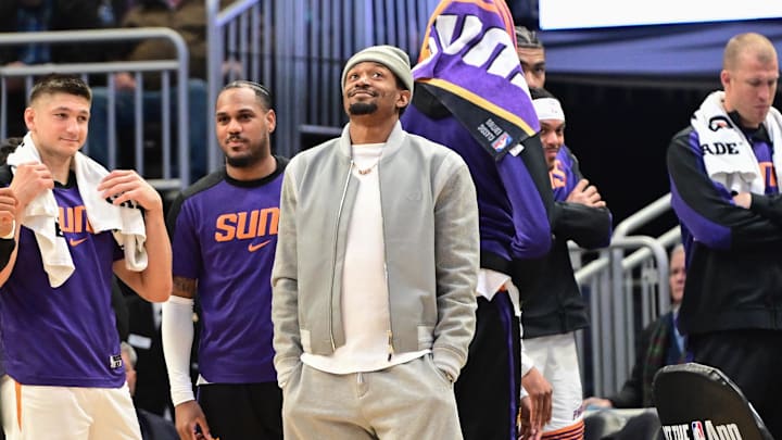Phoenix Suns forward Kevin Durant looks on in the fourth quarter while sidelined with an injury against the Milwaukee Bucks
