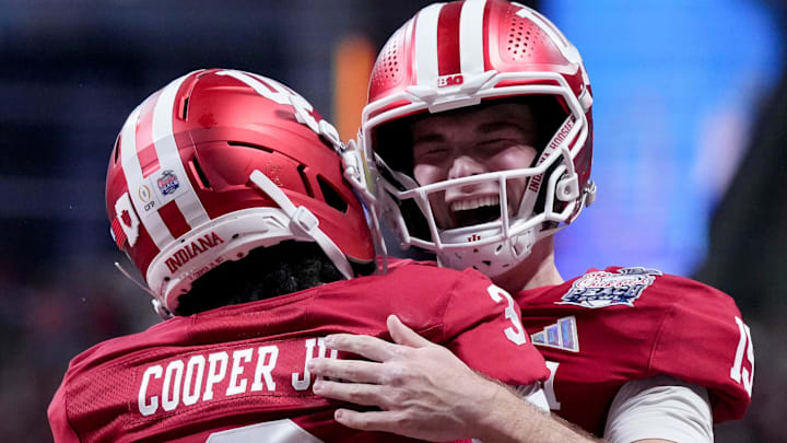 Indiana Hoosiers quarterback Fernando Mendoza (15) celebrates with Indiana Hoosiers wide receiver Omar Cooper Jr. (3) celebrate after connecting for a touchdown Friday, Jan. 9, 2026, during the Peach Bowl and semifinal game of the College Football Playoff against the Oregon Ducks at Mercedes-Benz Stadium in Atlanta.