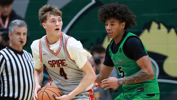 Jan 2, 2026; Mesa, AZ, USA; Arizona Compass Prep forward DeMarcus Henry (15) defends against Spire Institute (OH) guard Aiden Derkack (4) during the HoopHall West Tournament at Skyline High School. Mandatory Credit: Mark J. Rebilas-Imagn Images