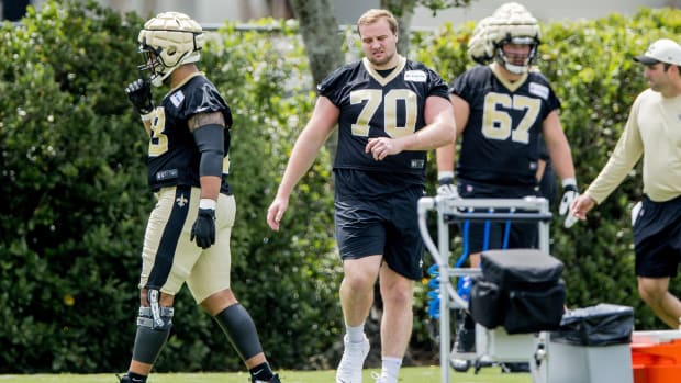 New Orleans Saints offensive tackle Trevor Penning (70) looks on during a minicamp practice