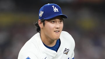 Oct 28, 2025; Los Angeles, California, USA; Los Angeles Dodgers two-way player Shohei Ohtani (17) throws to first for an out against Toronto Blue Jays third baseman Addison Barger (47)