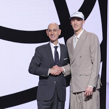 Jun 25, 2025; Brooklyn, NY, USA;  Egor Demin stands with NBA commissioner Adam Silver after being selected as the eighth pick by the Brooklyn Nets in the first round of the 2025 NBA Draft at Barclays Center. Mandatory Credit: Brad Penner-Imagn Images