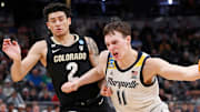 Colorado Buffaloes guard KJ Simpson (2) defends Marquette Golden Eagles guard Tyler Kolek (11) during NCAA Tournament game, Sunday, March 24, 2024, at Gainbridge Fieldhouse in Indianapolis.