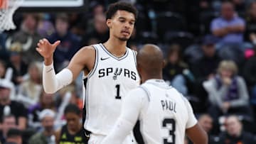 Oct 31, 2024; Salt Lake City, Utah, USA; San Antonio Spurs center Victor Wembanyama (1) and guard Chris Paul (3) react to a play against the Utah Jazz during the third quarter at Delta Center. Mandatory Credit: Rob Gray-Imagn Images