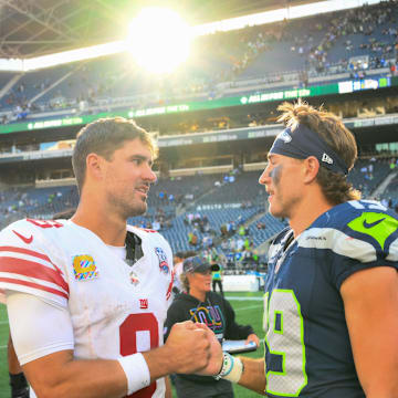 Oct 6, 2024; Seattle, Washington, USA; New York Giants quarterback Daniel Jones (8) and Seattle Seahawks wide receiver Jake Bobo (19) shake hands after the game at Lumen Field. 