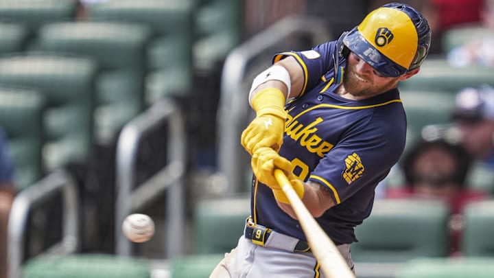 Aug 8, 2024; Cumberland, Georgia, USA; Milwaukee Brewers first baseman Jake Bauers (9) hits a home run against the Atlanta Braves during the fifth inning at Truist Park Aug 8, 2024; Cumberland, Georgia, USA; Milwaukee Brewers first baseman Jake Bauers (9) hits a home run against the Atlanta Braves during the fifth inning at Truist Park
