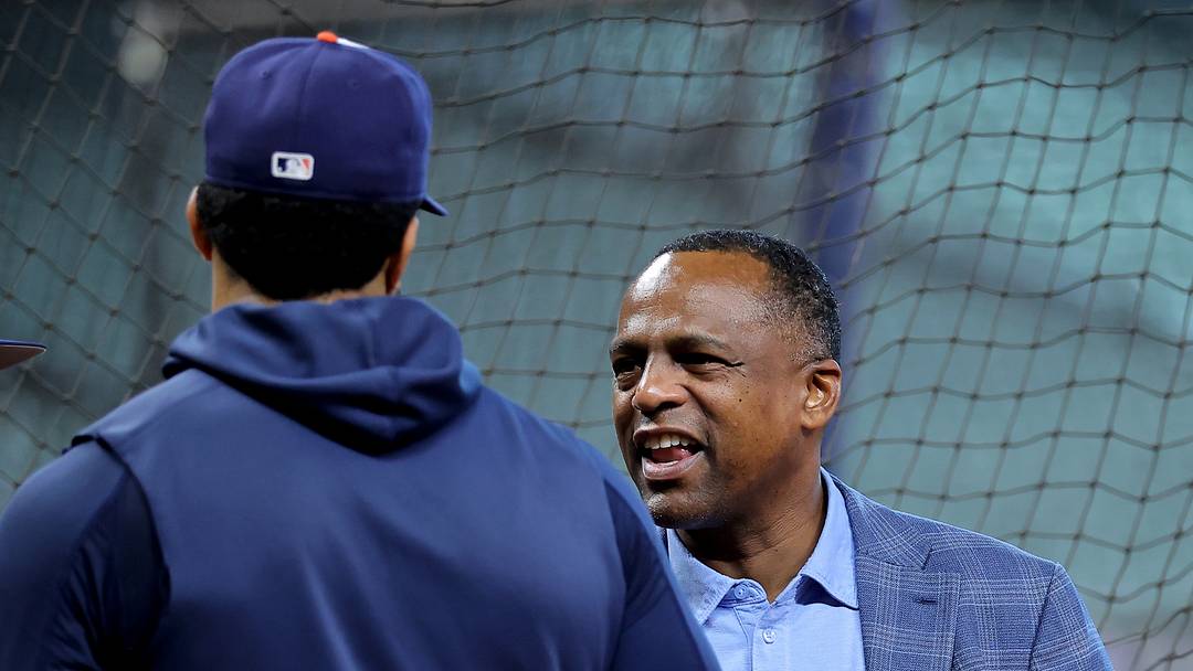 Jul 20, 2026; Houston, Texas, USA; Houston Astros general manager Dana Brown (right) talks with shortstop Jeremy Pena (left) is greeted by prior to the game against the Miami Marlins at Daikin Park. Mandatory Credit: Erik Williams-Imagn Images