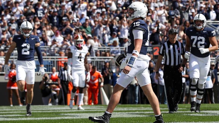 Sep 7, 2024; University Park, Pennsylvania, USA; Penn State Nittany Lions quarterback Drew Allar (15) celebrates after scoring a touchdown during the first quarter against the Bowling Green Falcons at Beaver Stadium. Mandatory Credit: Matthew O'Haren-Imagn Images