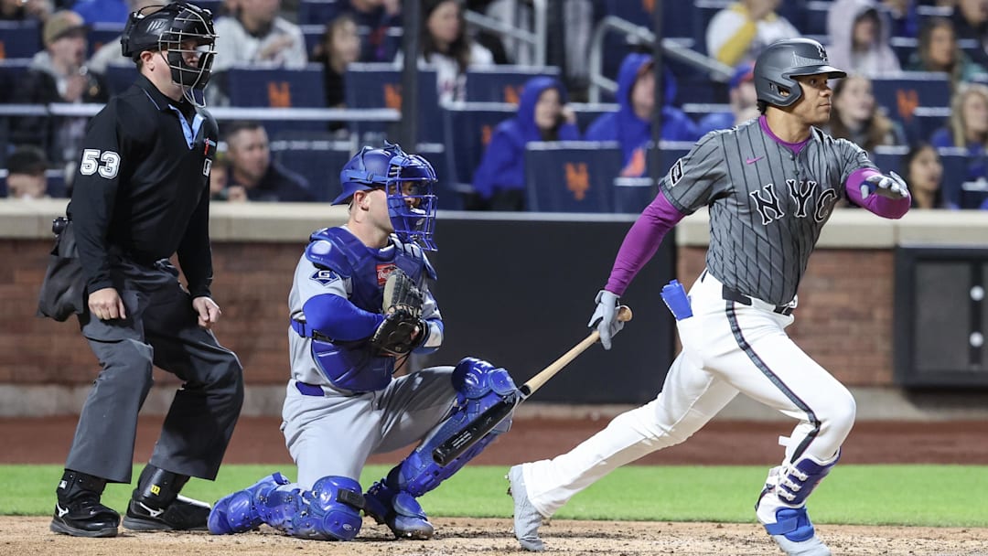 May 24, 2025; New York City, New York, USA;  New York Mets right fielder Juan Soto (22) hits a two run double in the fourth inning against the Los Angeles Dodgers at Citi Field. Mandatory Credit: Wendell Cruz-Imagn Images