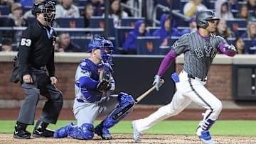 May 24, 2025; New York City, New York, USA;  New York Mets right fielder Juan Soto (22) hits a two run double in the fourth inning against the Los Angeles Dodgers at Citi Field. Mandatory Credit: Wendell Cruz-Imagn Images