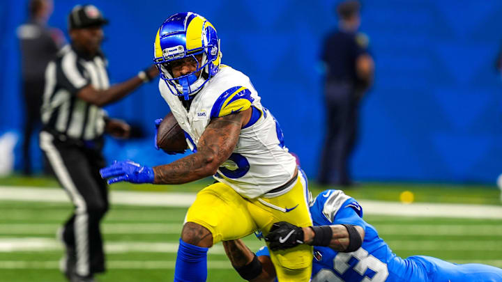 Los Angeles Rams running back Kyren Williams (23) is wrapped up by Detroit Lions cornerback Carlton Davis III (23) during the first half of the Detroit Lions season opener against the Los Angeles Rams at Ford Field in Detroit, on Sunday, Sept. 8. 2024.