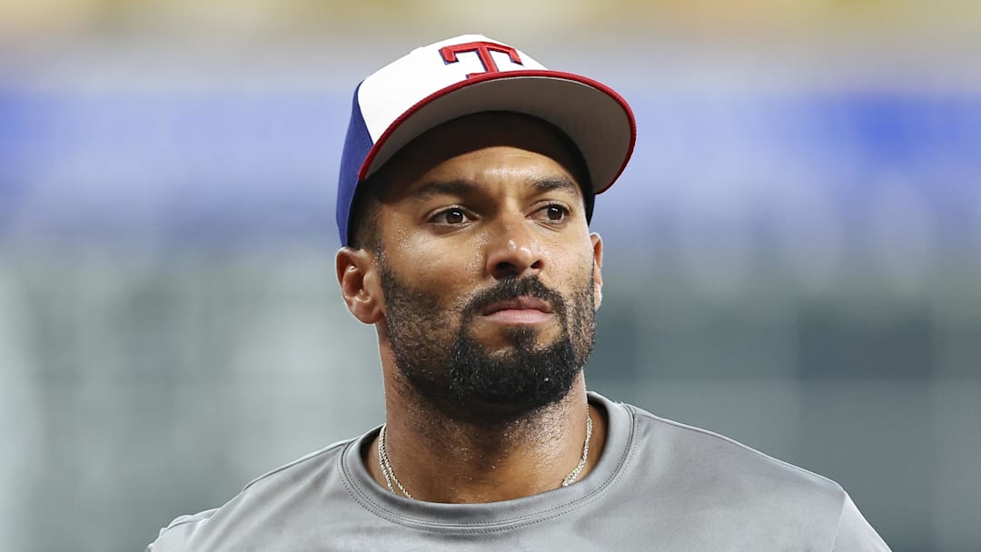 Jul 11, 2025; Houston, Texas, USA; Texas Rangers second baseman Marcus Semien (2) wears a Together for Texas shirt in support of Texas flood victims before the game against the Houston Astros at Daikin Park. Mandatory Credit: Troy Taormina-Imagn Images