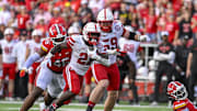 Nebraska Cornhuskers running back Emmett Johnson (21) rushes as Maryland Terrapins defensive lineman Dillan Fontus (46) pursues during the first half at SECU Stadium.