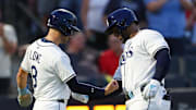 Tampa Bay Rays designated hitter Yandy Diaz (2) celebrates with second baseman Brandon Lowe (8) after hitting a two run home run against the Philadelphia Phillies in the fourth inning at George M. Steinbrenner Field. 