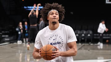 Jan 21, 2025; Brooklyn, New York, USA;  New York Knicks center Jericho Sims (20) warms up prior to the game against the Brooklyn Nets at Barclays Center. Mandatory Credit: Wendell Cruz-Imagn Images