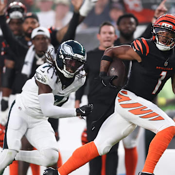 Aug 7, 2025; Philadelphia, Pennsylvania, USA; Cincinnati Bengals wide receiver Ja'Marr Chase (1) runs for a touchdown past Philadelphia Eagles cornerback Kelee Ringo (7) after a catch during the first quarter at Lincoln Financial Field. 