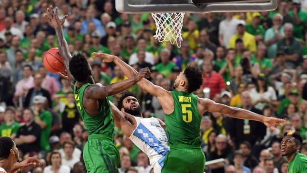 Oregon Ducks forward Jordan Bell (1) blocks the shot of North Carolina Tar Heels guard Joel Berry II (2)