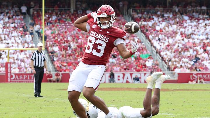 Sep 27, 2025; Fayetteville, Arkansas, USA; Arkansas Razorbacks tight end Jaden Platt (83) bobbles the football in the third quarter against the Notre Dame Fighting Irish at Donald W. Reynolds Razorback Stadium. Notre Dame won 56-13. Mandatory Credit: Nelson Chenault-Imagn Images