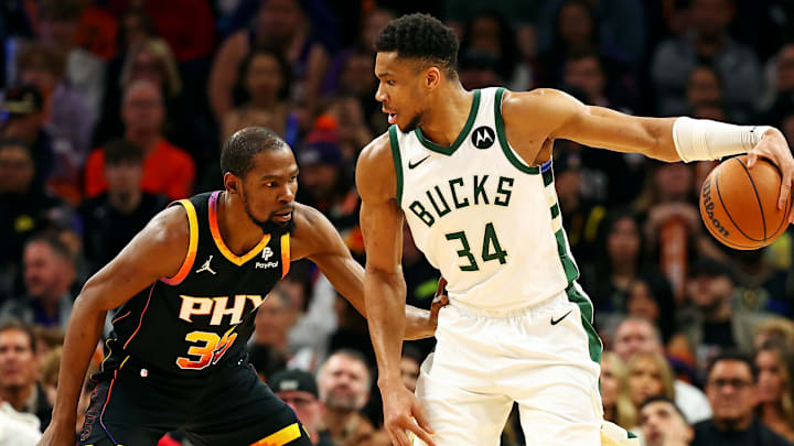 Feb 6, 2024; Phoenix, Arizona, USA; Milwaukee Bucks forward Giannis Antetokounmpo (34) handles the ball against the Phoenix Suns forward Kevin Durant (35) during the third quarter at Footprint Center. Mandatory Credit: Mark J. Rebilas-Imagn Images Feb 6, 2024; Phoenix, Arizona, USA; Milwaukee Bucks forward Giannis Antetokounmpo (34) handles the ball against the Phoenix Suns forward Kevin Durant (35) during the third quarter at Footprint Center. Mandatory Credit: Mark J. Rebilas-Imagn Images