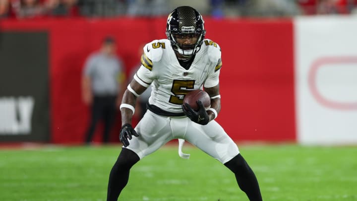 Dec 5, 2022; Tampa, Florida, USA;  New Orleans Saints wide receiver Jarvis Landry (5) runs with the ball against the Tampa Bay Buccaneers in the first quarter at Raymond James Stadium.