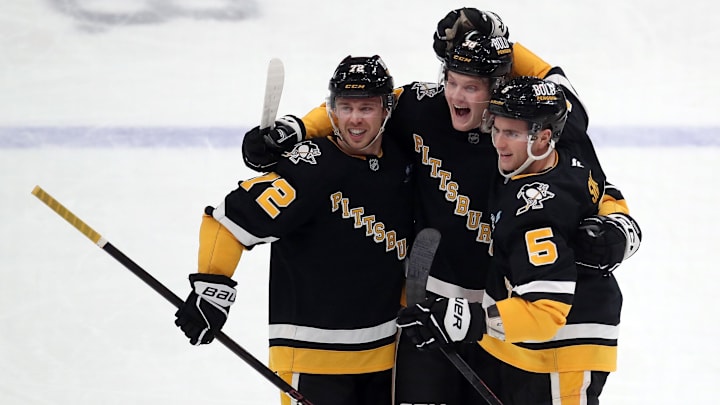 Dec 3, 2024; Pittsburgh, Pennsylvania, USA; Pittsburgh Penguins defenseman Owen Pickering (middle) celebrates with left wing Anthony Beauvillier (72) and defenseman Ryan Shea (5) after scoring his first career NHL goal against the Florida Panthers during the first period at PPG Paints Arena. Mandatory Credit: Charles LeClaire-Ima Dec 3, 2024; Pittsburgh, Pennsylvania, USA; Pittsburgh Penguins defenseman Owen Pickering (middle) celebrates with left wing Anthony Beauvillier (72) and defenseman Ryan Shea (5) after scoring his first career NHL goal against the Florida Panthers during the first period at PPG Paints Arena. Mandatory Credit: Charles LeClaire-Ima