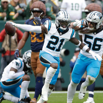 Carolina Panthers safety Nick Scott (21) celebrates recovering a fumble by Green Bay Packers wide receiver Savion Williams (83) during their football game Sunday, November 2, 2025, at Lambeau Field in Green Bay, Wisconsin.