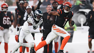 Aug 7, 2025; Philadelphia, Pennsylvania, USA; Cincinnati Bengals wide receiver Ja'Marr Chase (1) runs for a touchdown past Philadelphia Eagles cornerback Kelee Ringo (7) after a catch during the first quarter at Lincoln Financial Field. Mandatory Credit: Bill Streicher-Imagn Images