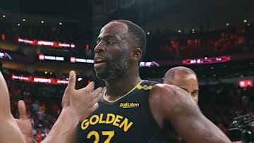 May 4, 2025; Houston, Texas, USA; Golden State Warriors forward Draymond Green (23) greets Houston Rockets forward Amen Thompson (1) after game seven of the first round for the 2025 NBA Playoffs at Toyota Center. Mandatory Credit: Troy Taormina-Imagn Images