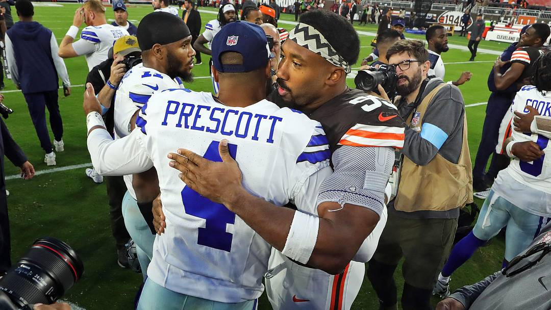 Cleveland Browns defensive end Myles Garrett hugs Dallas Cowboys quarterback Dak Prescott after a game at Huntington Bank Field Cleveland Browns defensive end Myles Garrett hugs Dallas Cowboys quarterback Dak Prescott after a game at Huntington Bank Field