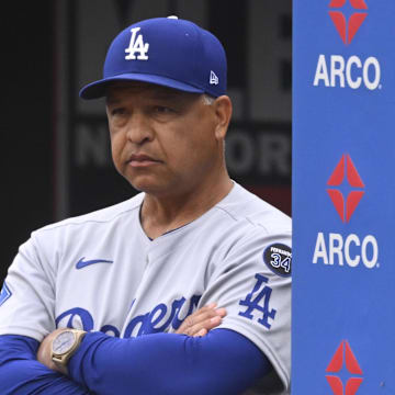  Los Angeles Dodgers manager Dave Roberts (30) stands in the dugout in the third inning against the Cleveland Guardians.