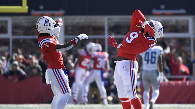 Former New England Patriots cornerback Jalen Mills (2) and linebacker Matthew Judon (9) react after a defensive touchdown.