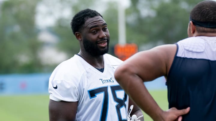 Titans Nicholas Petit-Frere (78) talks with a teammate after practice at the Tennessee Titans practice facility, Ascension St. Thomas Sports Park, Wednesday, July 26, 2023.