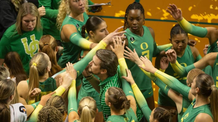 Oregon volleyball coach Matt Ulmer brings his team together during their match against Oregon State in Eugene Friday, Sept. 22, 2023.